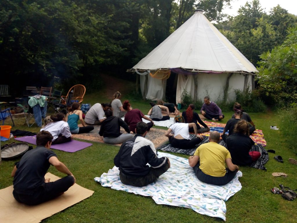 yoga outdoors whilst eco-camping in Devon